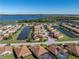Aerial view of a house nestled in a community by the lake at 3604 Blackmoor Ln, Lake Wales, FL 33859