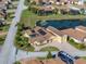 Aerial view of single-Gathering home with pool and solar panels at 3604 Blackmoor Ln, Lake Wales, FL 33859
