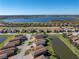 Aerial view showing house location in a community by a lake at 3604 Blackmoor Ln, Lake Wales, FL 33859