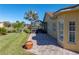 Brick paved patio, screened enclosure, and pond view at 3604 Blackmoor Ln, Lake Wales, FL 33859