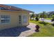 Large brick paved patio with terracotta pot next to house at 3604 Blackmoor Ln, Lake Wales, FL 33859