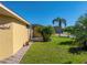 Landscaped backyard with brick paved walkway at 3604 Blackmoor Ln, Lake Wales, FL 33859
