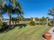 Landscaped backyard with pond view at 3604 Blackmoor Ln, Lake Wales, FL 33859