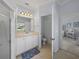 Clean bathroom with a single vanity, toilet, and a shower at 3604 Blackmoor Ln, Lake Wales, FL 33859