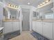 Elegant bathroom with dual vanities, a large mirror, and a spacious shower at 3604 Blackmoor Ln, Lake Wales, FL 33859