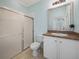 Bathroom with a shower, toilet and vanity with a large mirror at 3604 Blackmoor Ln, Lake Wales, FL 33859