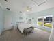 Bright bedroom with a queen bed, large window, and ceiling fan at 3604 Blackmoor Ln, Lake Wales, FL 33859