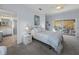 Bright bedroom with pool view, featuring a comfortable bed and direct access to the bathroom at 3604 Blackmoor Ln, Lake Wales, FL 33859