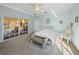 Bright bedroom with a queen bed and sliding doors leading to the pool area at 3604 Blackmoor Ln, Lake Wales, FL 33859