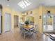 Bright dining area with wooden table, chairs, and access to the pool at 3604 Blackmoor Ln, Lake Wales, FL 33859