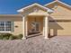 Front entry with columns and double doors leading into the house at 3604 Blackmoor Ln, Lake Wales, FL 33859
