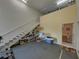 Garage with a half-bathroom, storage space, and stairs to upper level at 3604 Blackmoor Ln, Lake Wales, FL 33859