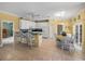 Updated kitchen featuring white cabinets, granite countertops, and eat-in area at 3604 Blackmoor Ln, Lake Wales, FL 33859