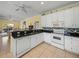 Spacious kitchen featuring granite countertops and a breakfast bar at 3604 Blackmoor Ln, Lake Wales, FL 33859