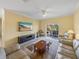 Relaxing living room with leather sofas, large TV, and sliding doors to patio at 3604 Blackmoor Ln, Lake Wales, FL 33859