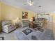 Open living room with leather sofas, view into kitchen, and access to patio at 3604 Blackmoor Ln, Lake Wales, FL 33859