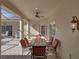 Covered patio with table and chairs, adjacent to pool at 3604 Blackmoor Ln, Lake Wales, FL 33859