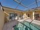 Screened pool and patio with seating and grill at 3604 Blackmoor Ln, Lake Wales, FL 33859