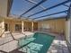 Private screened pool and patio with seating at 3604 Blackmoor Ln, Lake Wales, FL 33859