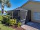 Relaxing screened patio with table and chairs, perfect for outdoor dining at 3604 Blackmoor Ln, Lake Wales, FL 33859