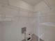 Spacious walk-in closet with shelves, hanging rods, and a safe at 3604 Blackmoor Ln, Lake Wales, FL 33859