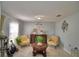 Living room featuring armchairs, coffee table, and decorative wall art at 42 Bolton Ct, Kissimmee, FL 34758