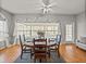 Dining room with a round wooden table and access to a screened porch at 4408 Waterford Dr, Lake Wales, FL 33859