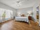 Main bedroom with hardwood floors and two nightstands at 4408 Waterford Dr, Lake Wales, FL 33859