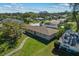 Aerial view of a ranch home and surrounding neighborhood at 501 Arneson Ave, Auburndale, FL 33823