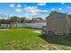 Large backyard with shed and white fence at 501 Arneson Ave, Auburndale, FL 33823