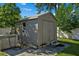 Tan shed with double doors in the backyard at 501 Arneson Ave, Auburndale, FL 33823