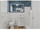 Updated bathroom with white vanity, new toilet, and light wood flooring at 501 Arneson Ave, Auburndale, FL 33823