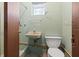 Small bathroom with toilet, sink, and bathtub at 501 Arneson Ave, Auburndale, FL 33823