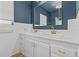 Double vanity bathroom with marble countertop and gold fixtures at 501 Arneson Ave, Auburndale, FL 33823