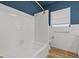 Updated bathroom with new bathtub, gold fixtures, and wood-look flooring at 501 Arneson Ave, Auburndale, FL 33823