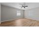 Bedroom with ceiling fan and light wood flooring at 501 Arneson Ave, Auburndale, FL 33823