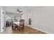 Bright dining room featuring hardwood floors and a charming table with chairs at 501 Arneson Ave, Auburndale, FL 33823