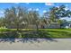House exterior showcasing a large front yard at 501 Arneson Ave, Auburndale, FL 33823