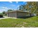 House exterior with a side view and garage at 501 Arneson Ave, Auburndale, FL 33823