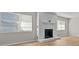 White brick fireplace in living room with light flooring at 501 Arneson Ave, Auburndale, FL 33823