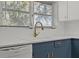 Modern kitchen features updated cabinetry, new Frigidaire dishwasher, and gold faucet at 501 Arneson Ave, Auburndale, FL 33823