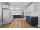 Renovated kitchen with white and blue cabinets, quartz countertops at 501 Arneson Ave, Auburndale, FL 33823