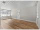 Spacious living room with hardwood floors and lots of natural light at 501 Arneson Ave, Auburndale, FL 33823