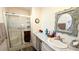 Updated bathroom with a walk-in shower and modern vanity at 6401 Lolly Bay Ne Loop, Winter Haven, FL 33881