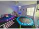 bedroom with a bed, small trampoline, and shelving at 1082 Sunshine Sw Way, Winter Haven, FL 33880