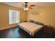 Main bedroom with a king-size bed and ceiling fan at 1082 Sunshine Sw Way, Winter Haven, FL 33880