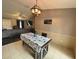 Farmhouse-style dining area with seating for four and view of living room at 1082 Sunshine Sw Way, Winter Haven, FL 33880
