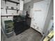 Laundry room with washer, dryer, and shelving at 1082 Sunshine Sw Way, Winter Haven, FL 33880