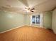 Bright bedroom with window, ceiling fan and tile floor at 1136 Bell Tower W Xing, Kissimmee, FL 34759