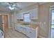 White kitchen with stainless steel appliances and double sink at 118 Whittier Ln, Winter Haven, FL 33884